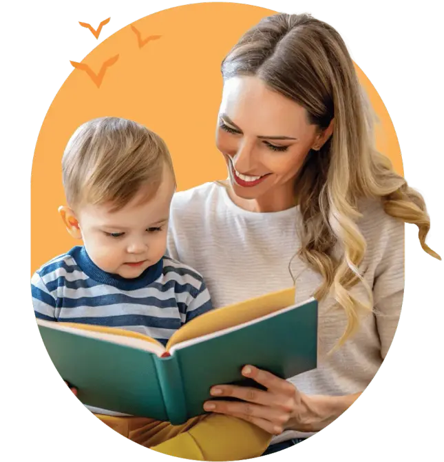 therapist reading a book to toddler boy