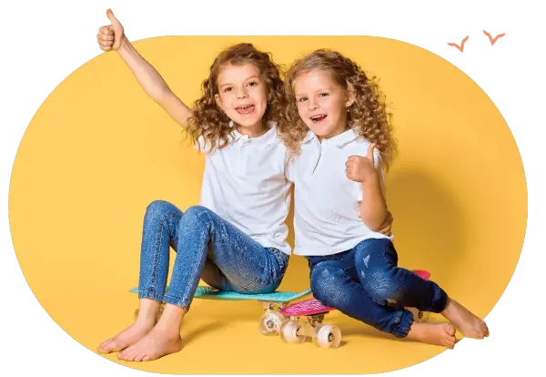 two girls sitting on skateboard